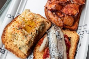 a white tray topped with different types of food