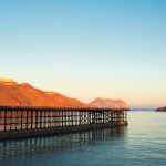 photo of brown dock near mountain