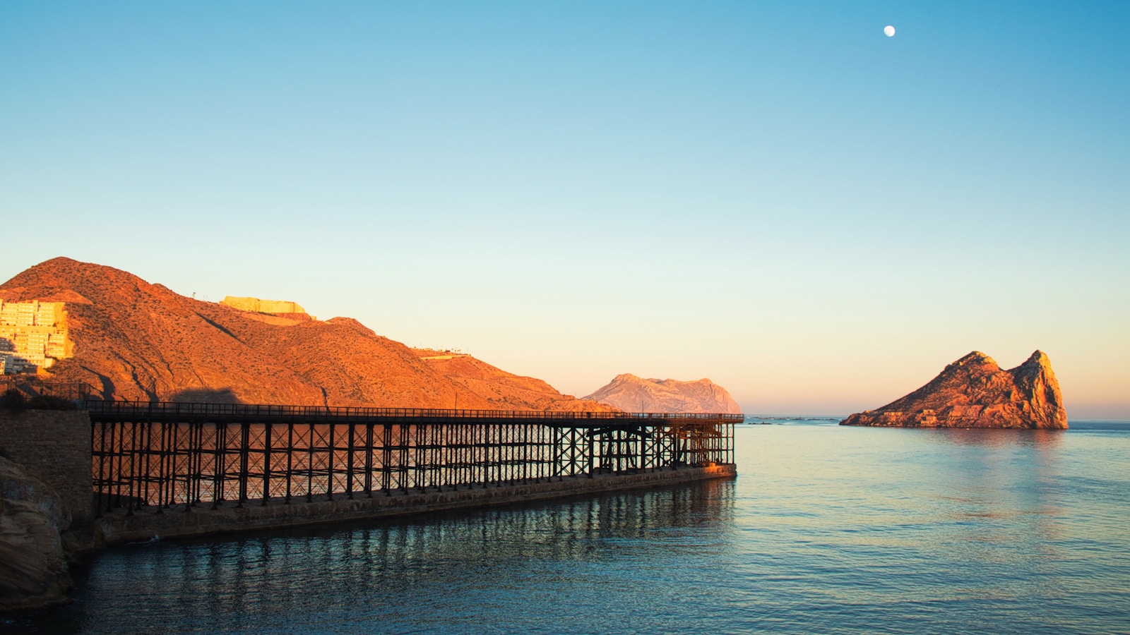 photo of brown dock near mountain