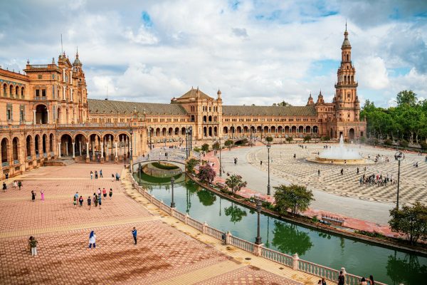 a large building with a fountain in front of it