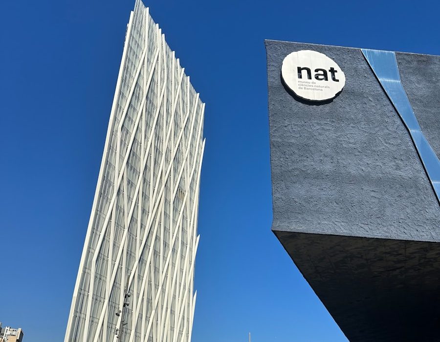 a tall building with a natt sign on it's side